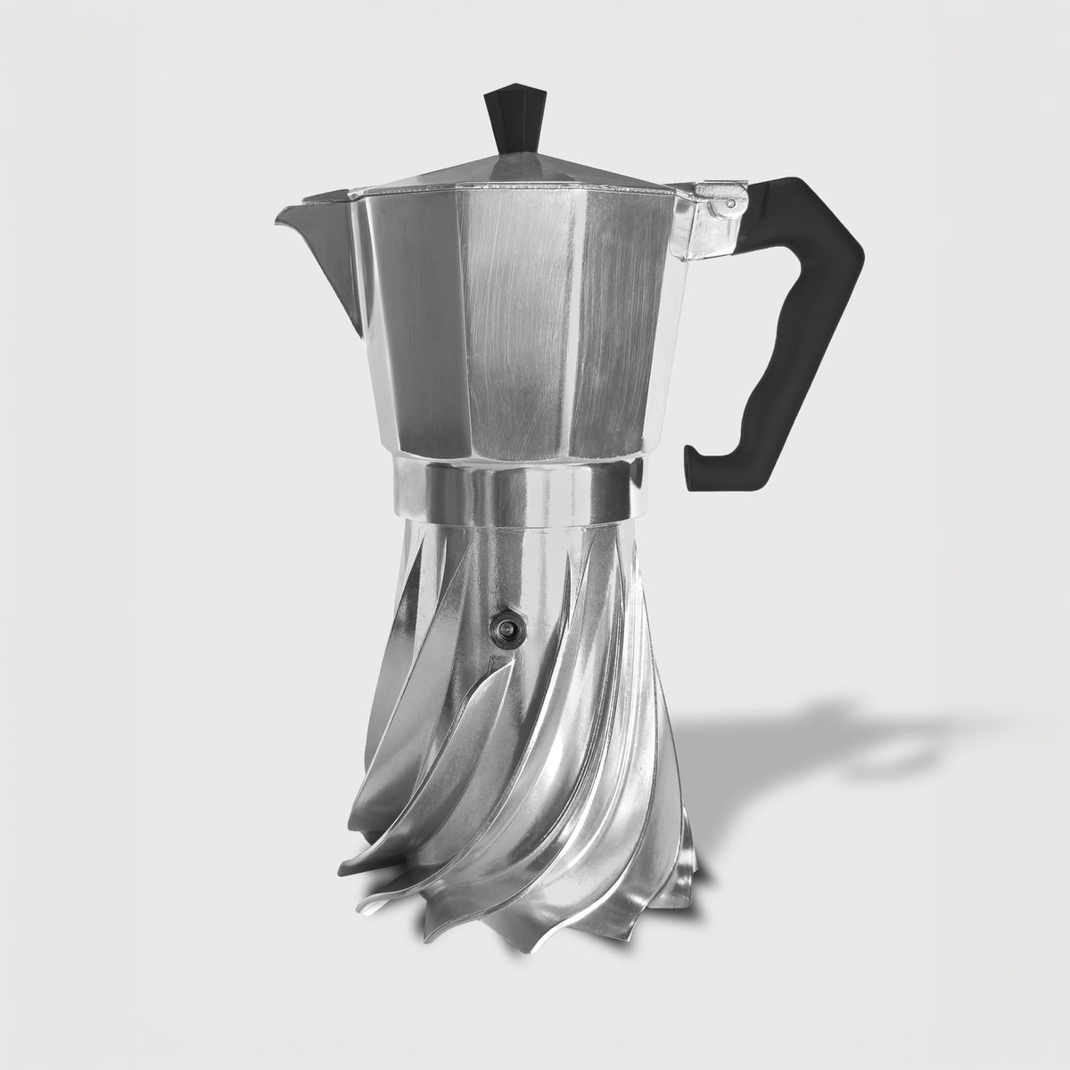 Black and white studio photograph of the Turbo Moka 6-cup aluminium moka pot on a plain grey background, showing the turbine-finned base